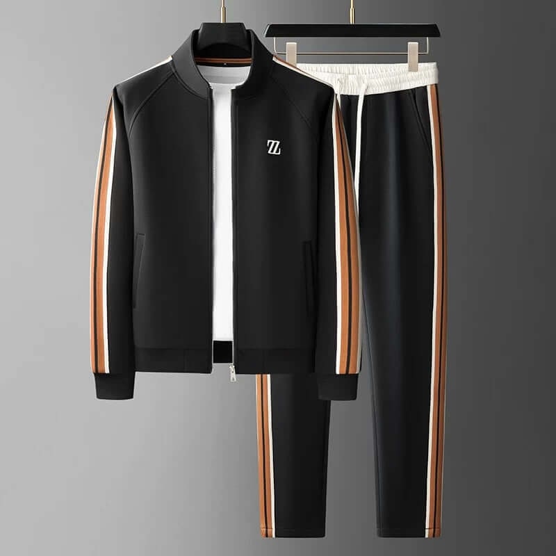 Uomo in tuta sportiva completa, ideale per allenamento, jogging o relax. Giacca con zip e pantaloni casual.