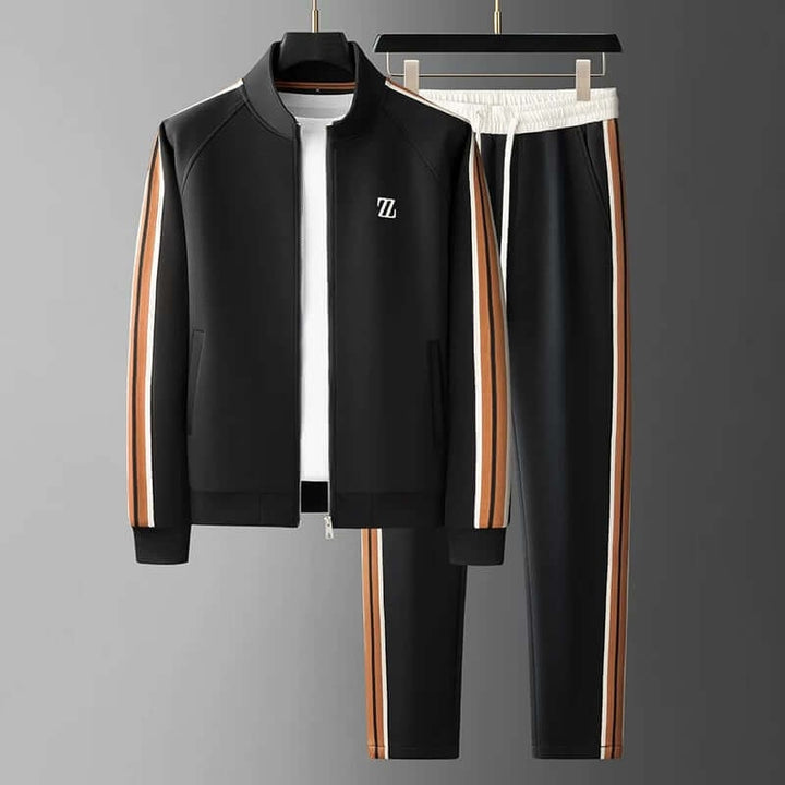 Uomo in tuta sportiva completa, ideale per allenamento, jogging o relax. Giacca con zip e pantaloni casual.