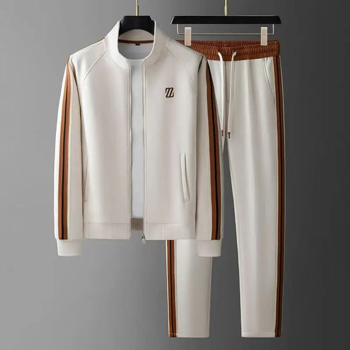 Giacca sportiva zip e pantaloni tuta uomo, completo elegante per jogging e tempo libero.