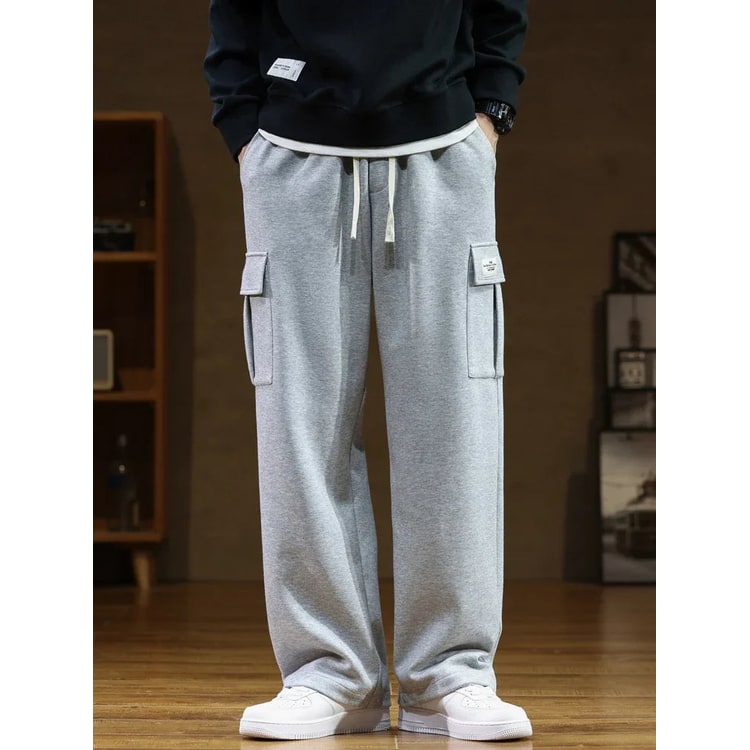 Comodi pantaloni cargo larghi uomo per tempo libero, stile sportivo casual con tasche ampie e vita elastica.