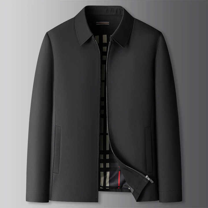 Uomo con giacca a vento elegante, giacca leggera da mezza stagione con fodera a quadri. Stile casual maschile.