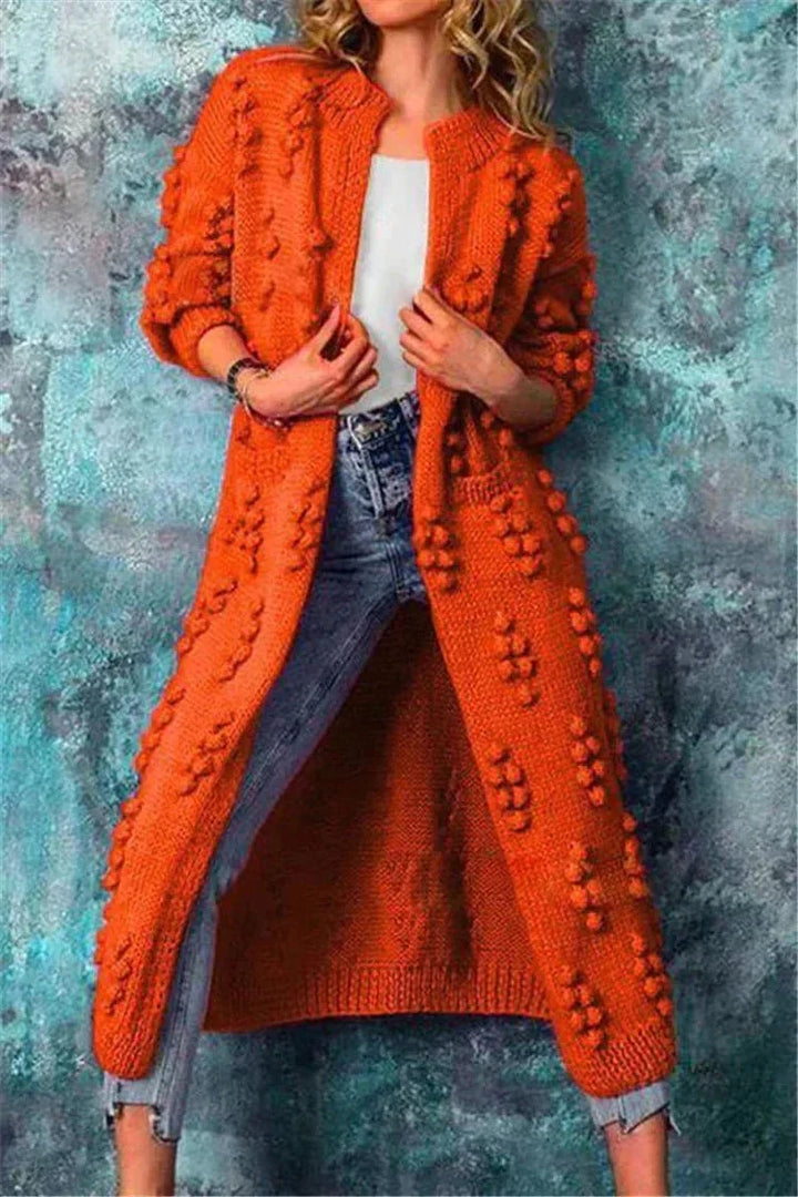 Elegante cardigan lungo da donna, in maglia morbida, con vestibilità comoda per ogni occasione.