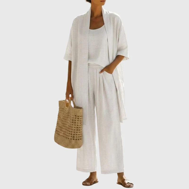 Completo donna 3 pezzi in lino estivo con pantaloni palazzo, top e cardigan coordinato, stile casual-elegante.