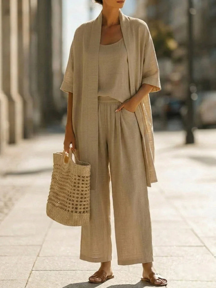 Versatile completo donna in lino 3 pezzi: pantaloni palazzo, top e cardigan, ideale per un look estivo chic.