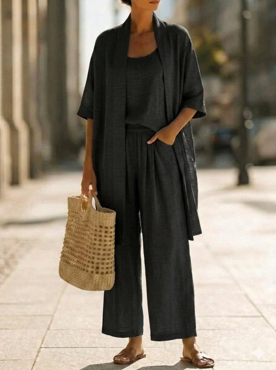 Completo coordinato donna 3 pezzi in lino fresco con pantaloni palazzo larghi, top e cardigan estivo.