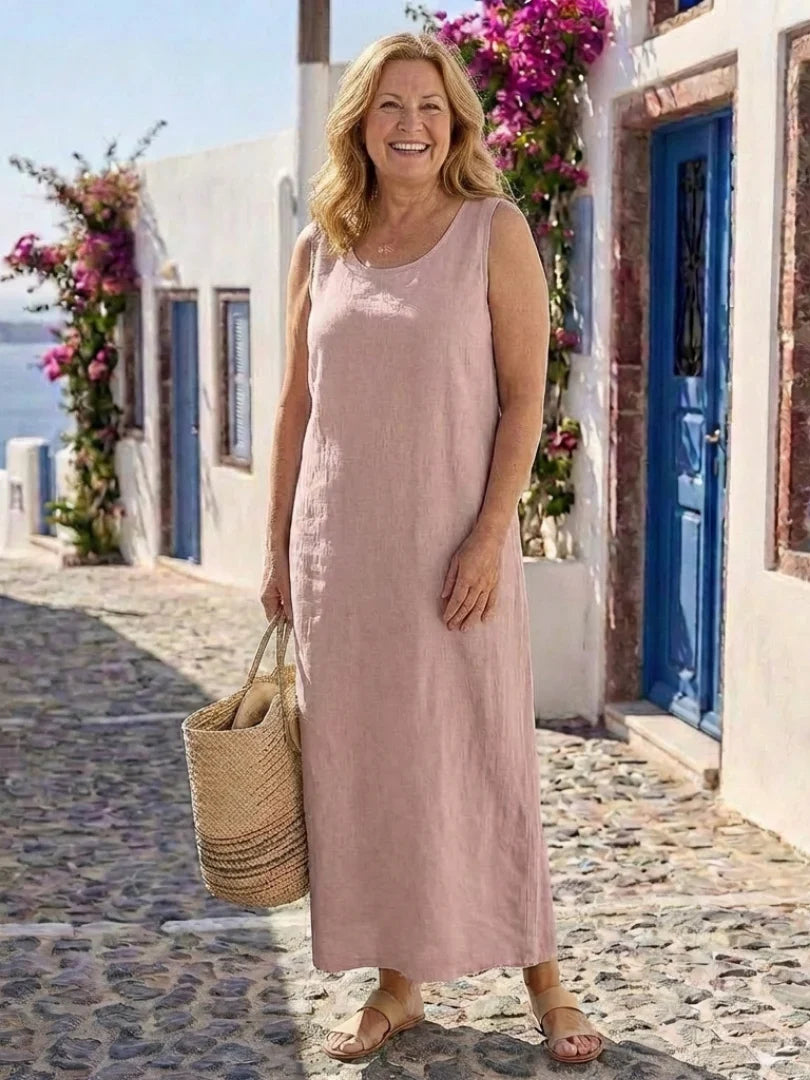 Vestito maxi donna per eleganza estiva. Senza maniche, scollo rotondo. Abito lungo casual, moda femminile.