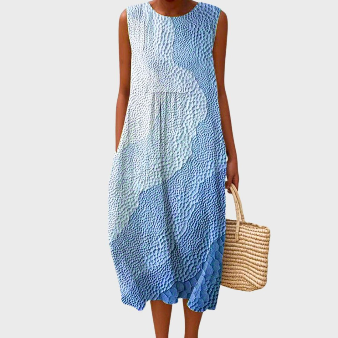 Abito midi donna estivo a quadri grigio chiaro, senza maniche e gonna svasata, comodo e casual per la primavera.