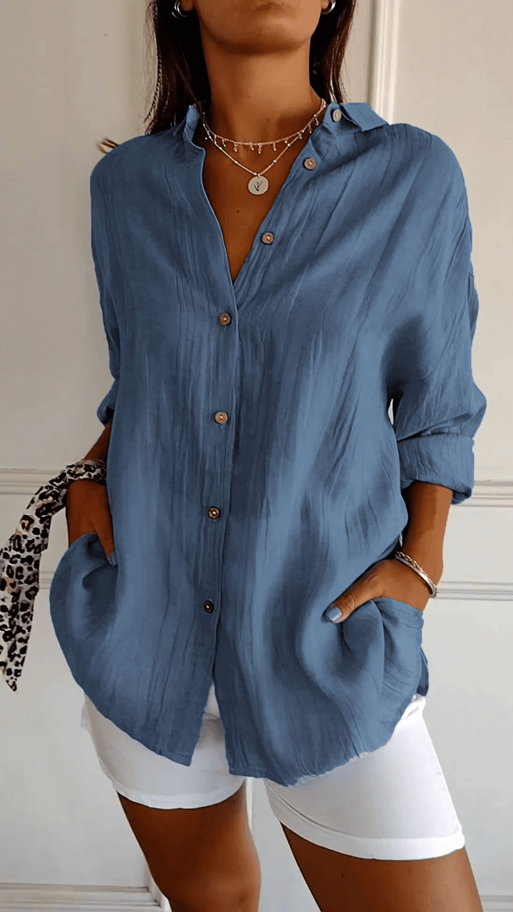 Camicia donna elegante a maniche lunghe, design slim fit per un abbigliamento raffinato e alla moda.