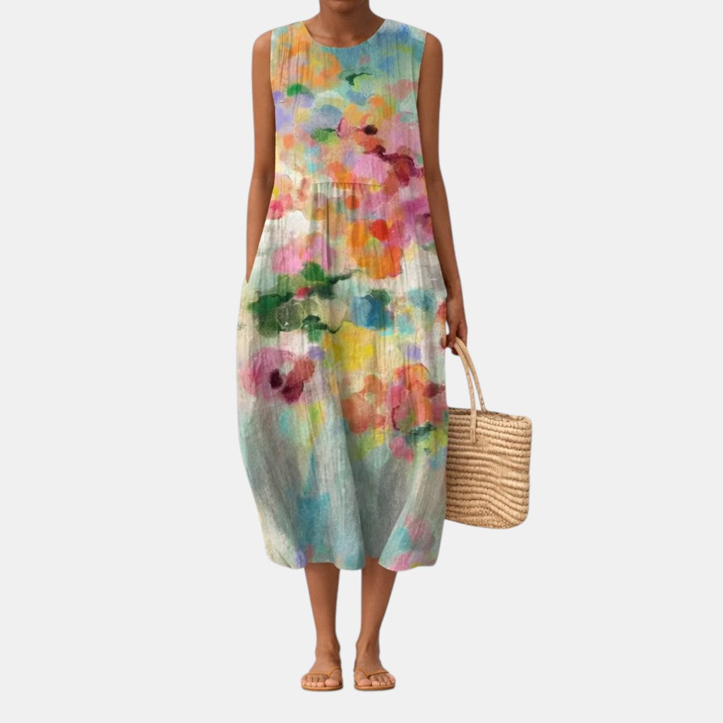 Vestito midi donna smanicato casual ed elegante, ideale per vacanze. Stampa acquerello vibrante, comfort assicurato.
