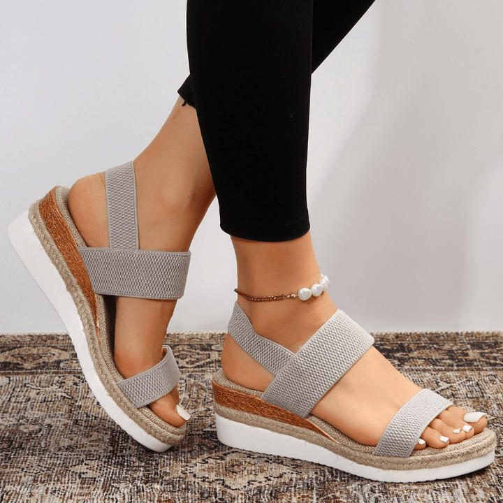 Sandali donna con zeppa, cinturino elastico. Perfetti per stile casual o elegante, comfort estivo garantito.