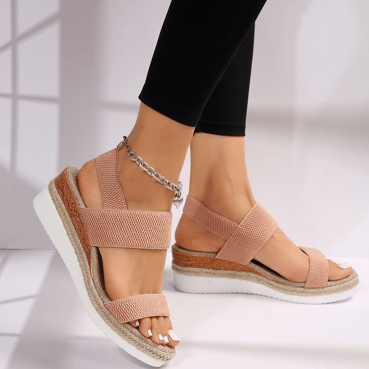 Sandali donna con zeppa e cinturino elastico. Stile moderno e comfort per le tue giornate estive.