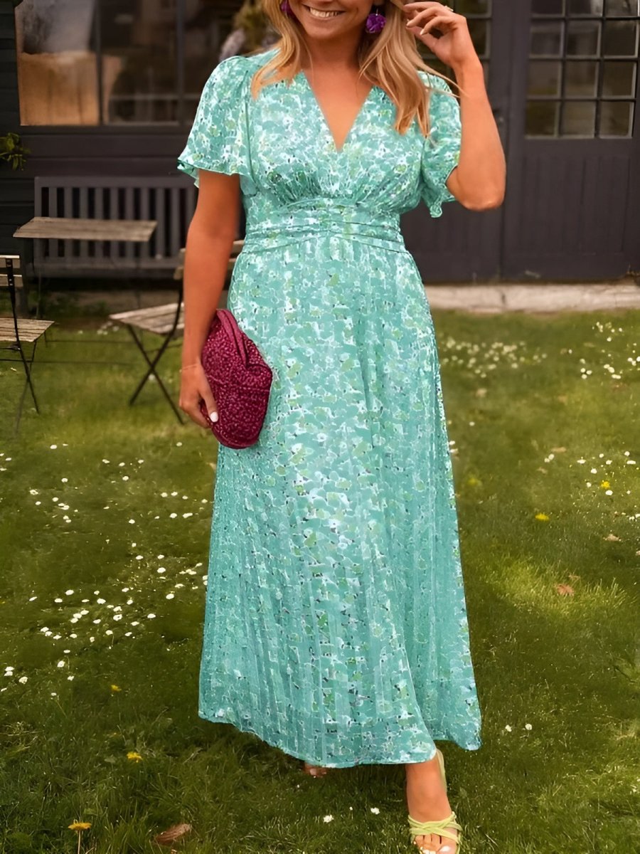 Design di abito lungo floreale da donna con scollo a V e maniche corte. Vestito estivo alla moda.