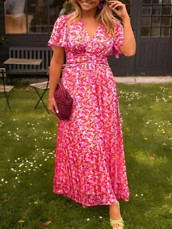 Abito lungo floreale da donna, maniche corte e scollo a V. Perfetto per outfit casual o eleganti estivi.