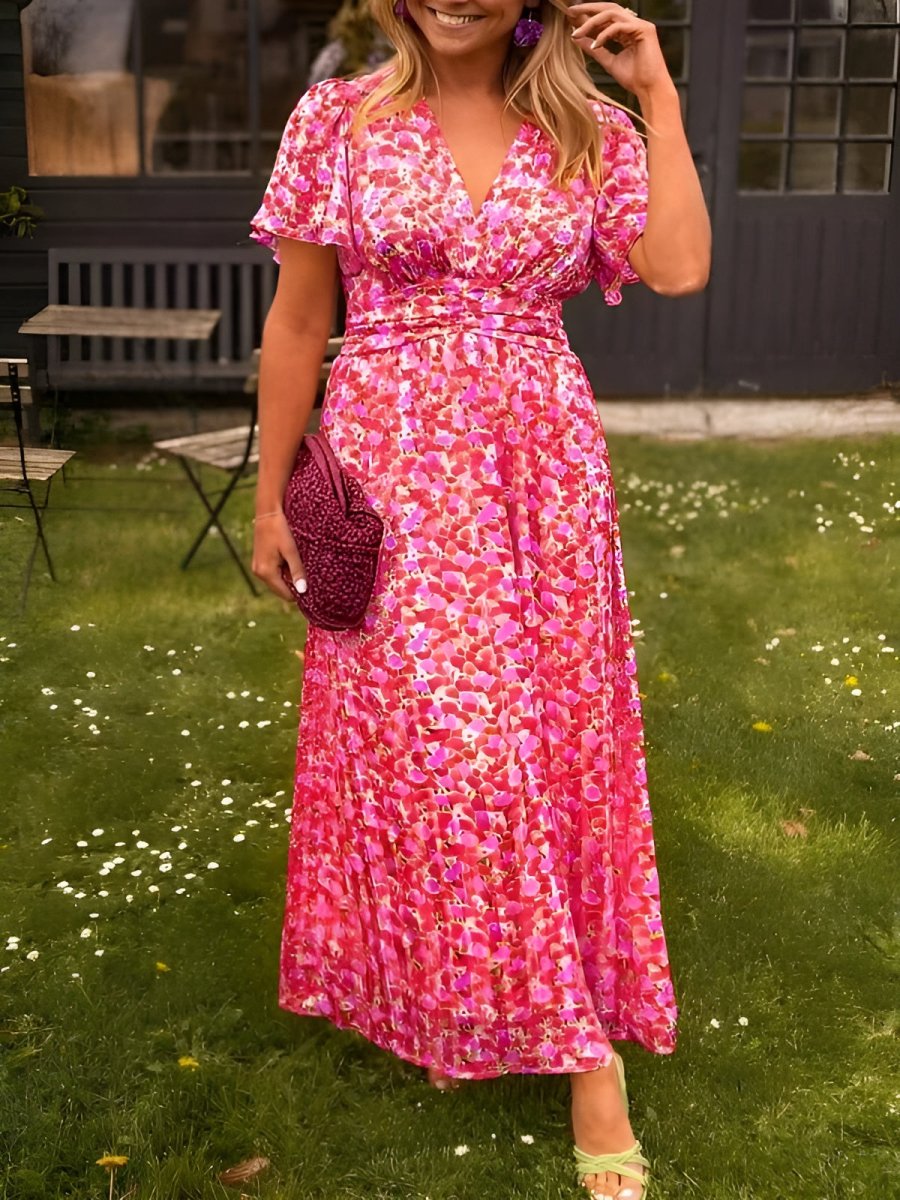 Abito lungo estivo multicolore con stampa a fiori, scollo a V. Ideale per look casual-elegante da giorno.