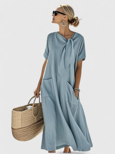 Abito senza maniche da donna, dal design fluido ed elegante, per un look raffinato in ogni occasione.