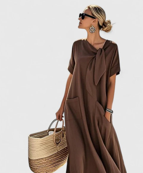 Abito elegante da donna senza maniche, stile fluido, perfetto per primavera ed estate.
