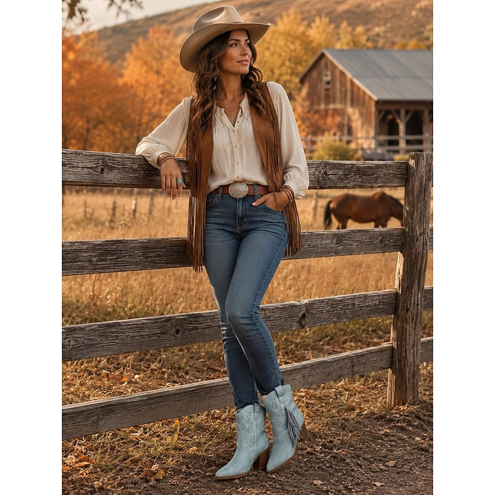 Stivaletti western rosa eleganti, con nappe in movimento, punta affusolata e tacco largo. Scarpe donna.