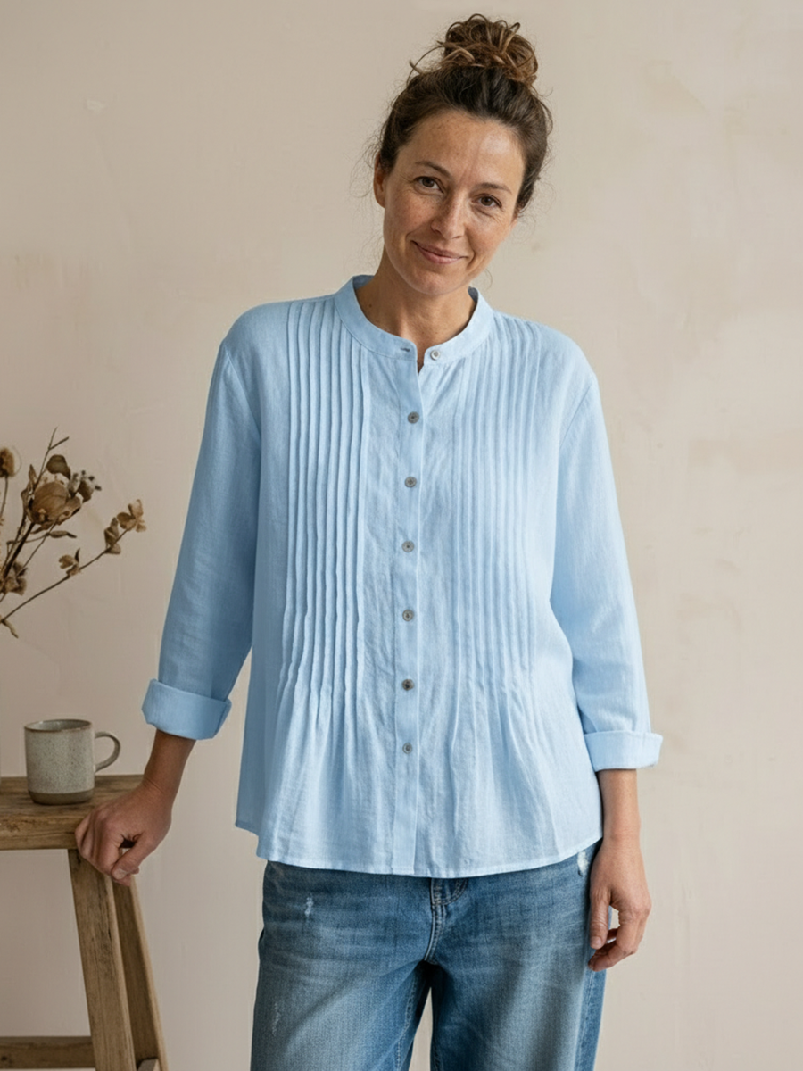 Ampia camicia donna in cotone plissettata, leggera e traspirante, ideale per un'estate confortevole e alla moda.