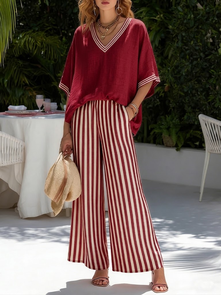 Pantaloni a righe verticali ampi e fluidi, parte del set completo donna. Perfetti per relax e stile estivo.