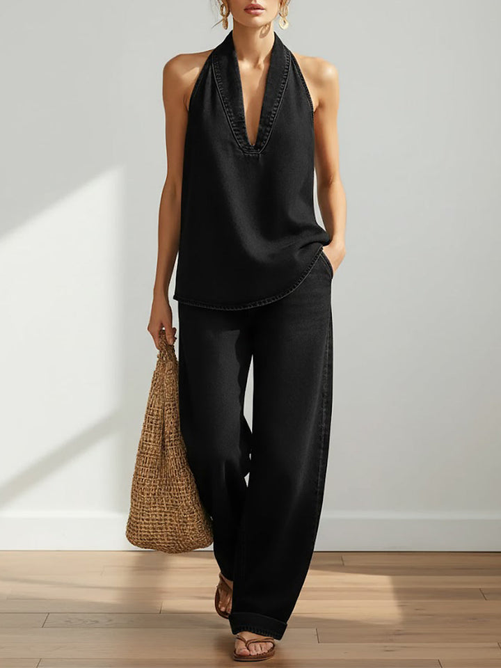 Outfit donna due pezzi in cotone lino, con pantaloni ampi e top senza maniche, stile minimalista.