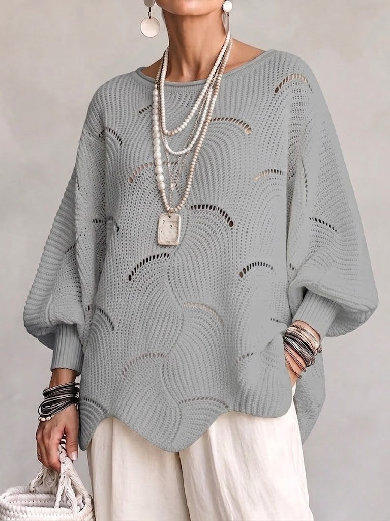 Maglione donna traforato, look autunnale o primavera. Vestibilità ampia, maniche a pipistrello, stile bohémien.