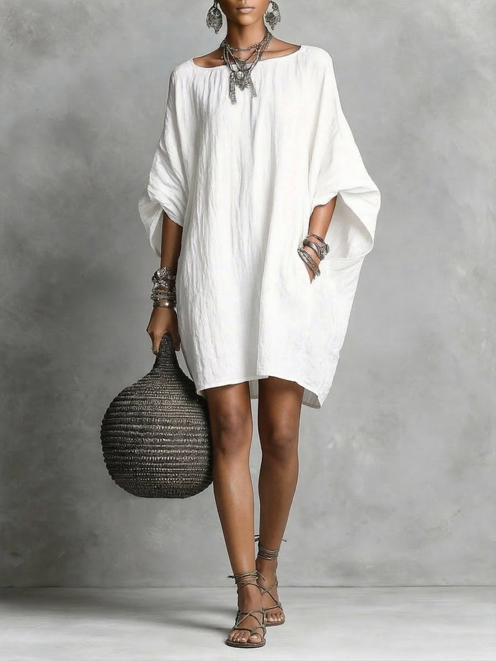 Vestito estivo donna in cotone e lino leggero, ideale per viaggi o look casual primaverili.