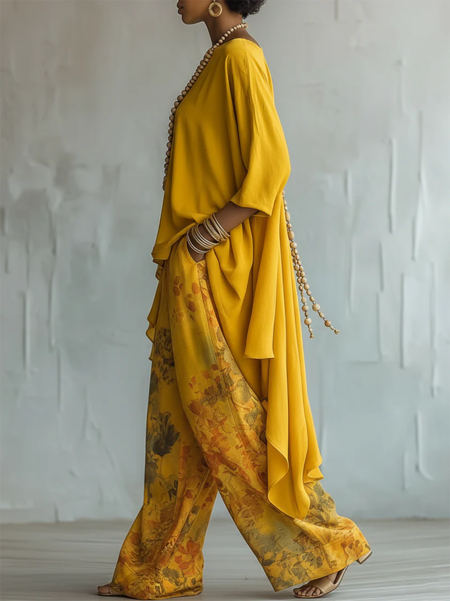 Outfit boho femminile: pantaloni floreali larghi e blusa asimmetrica leggera. Ideale per la moda estiva.