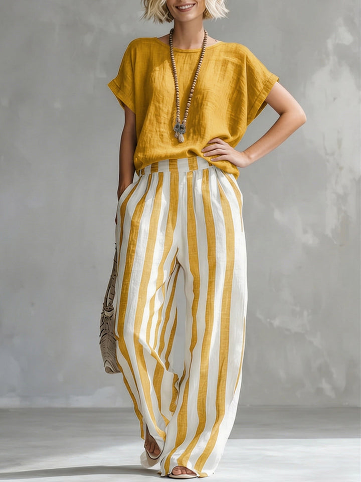 Completo due pezzi in cotone lino morbido e fresco, con design a righe. Ideale per la moda donna estiva.