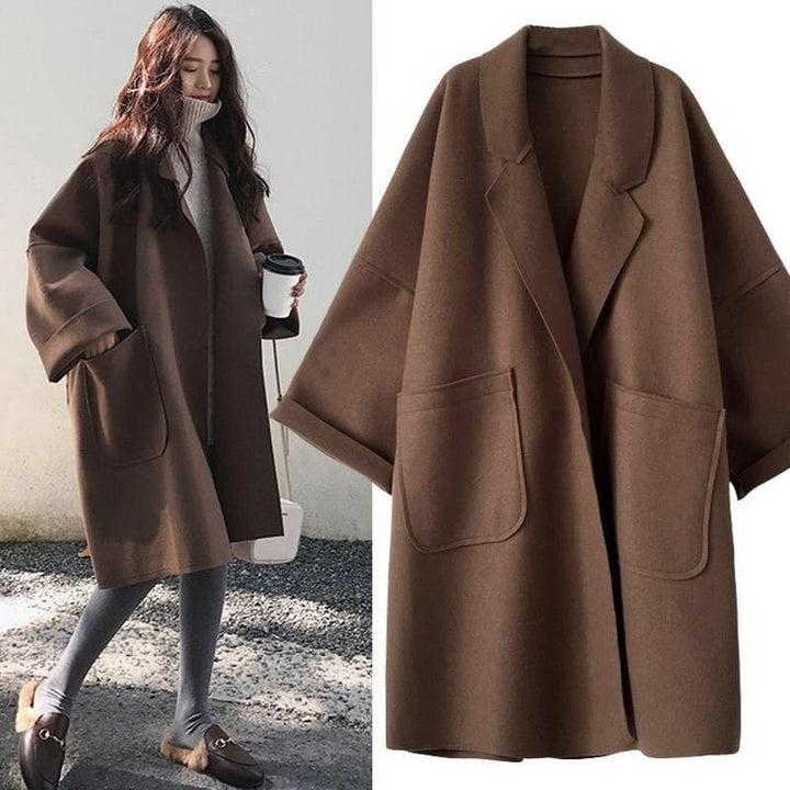 Cappotto lungo oversize da donna, elegante trench doppiopetto per moda autunno/inverno.