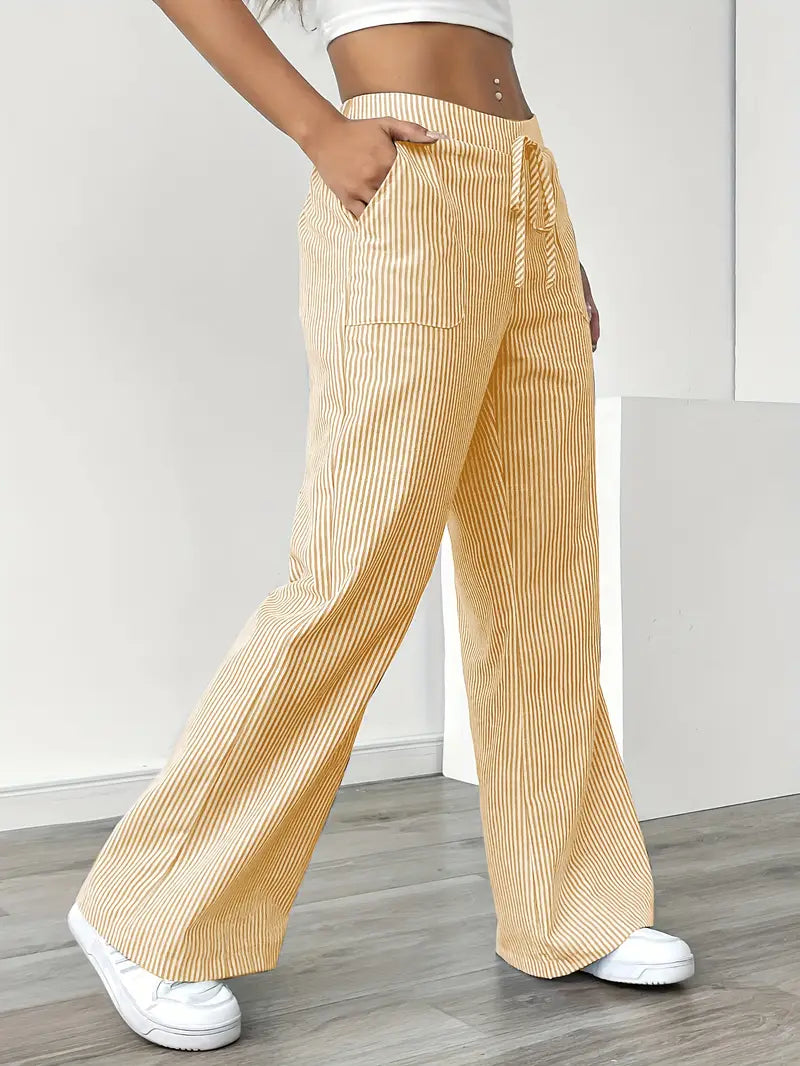 Look elegante con pantaloni donna a righe, vita alta, gamba larga. Ideali per outfit formali e comodi. Versatili.