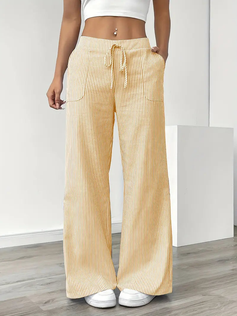 Pantaloni donna a gamba larga a righe, vita alta. Look estivo casual chic, comodi e versatili per ogni giorno.