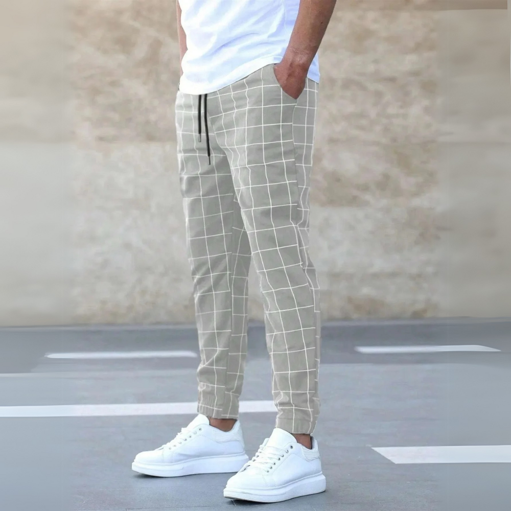 Jogger uomo casual a quadri, vita elasticizzata. Pantaloni affusolati, perfetti per streetwear, sport e tempo libero.