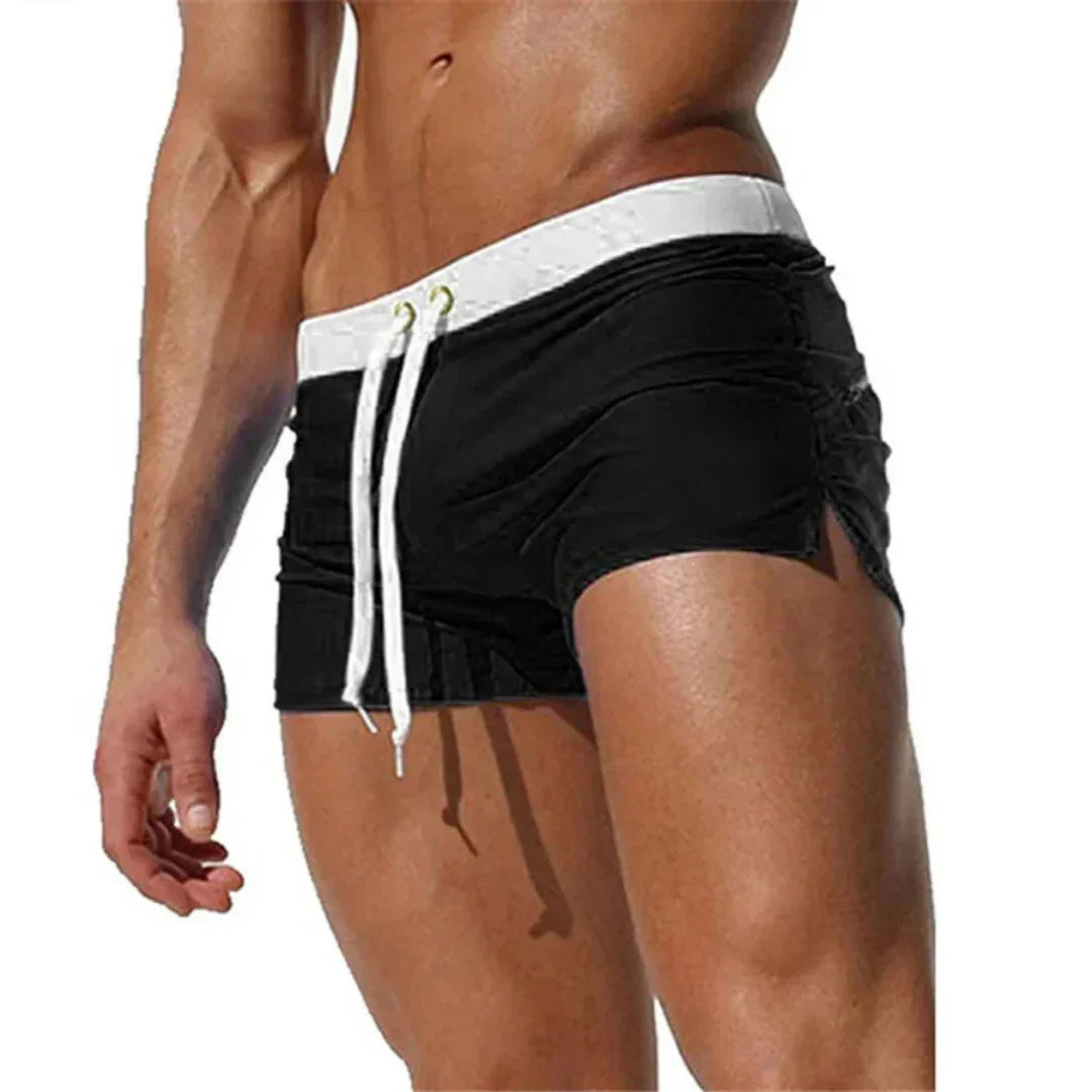 Shorts da bagno maschili con pannelli a contrasto. Perfetti per sport acquatici, asciugano in fretta.