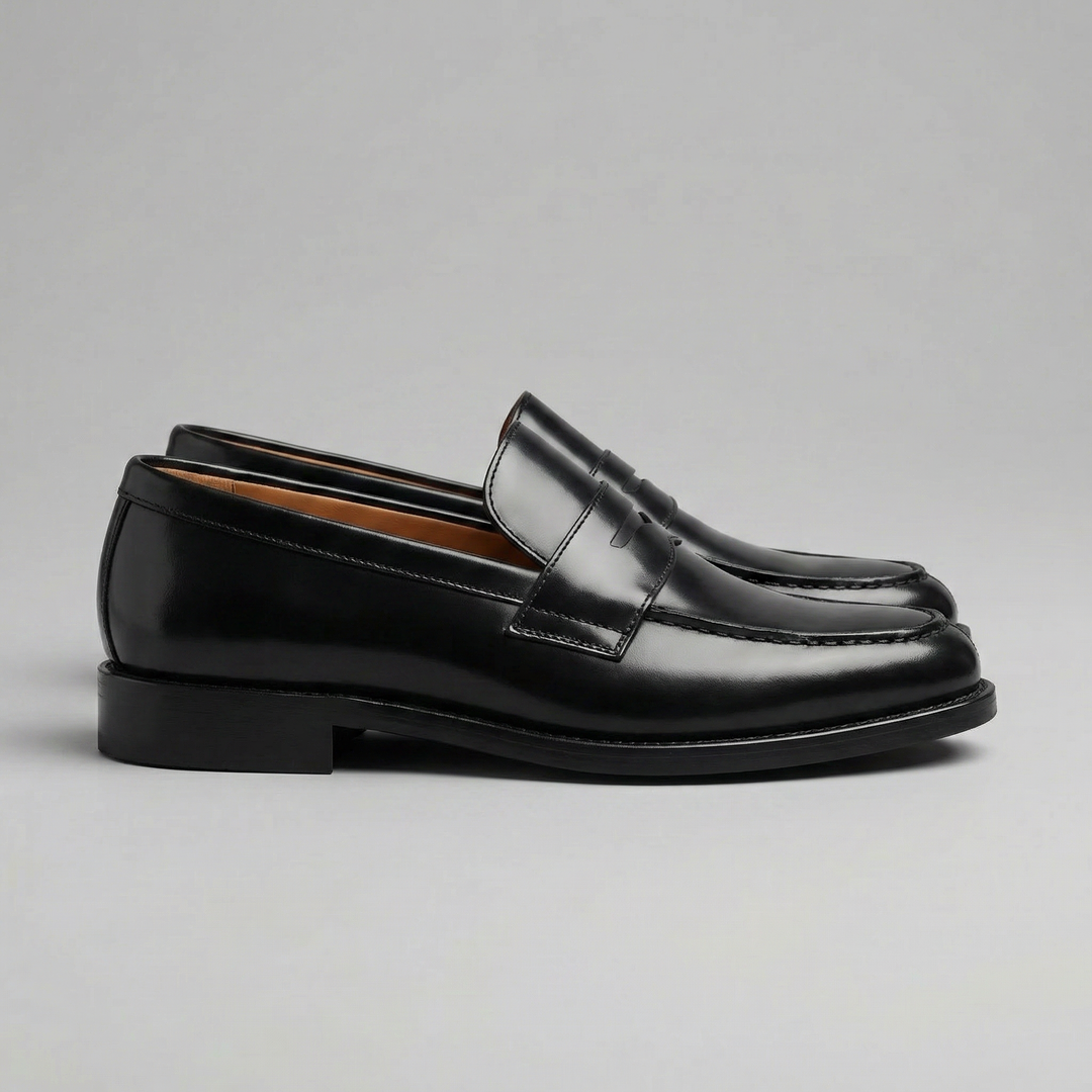 Scarpe uomo slip-on, mocassini Penny neri per look smart casual e comfort quotidiano. Stile versatile.