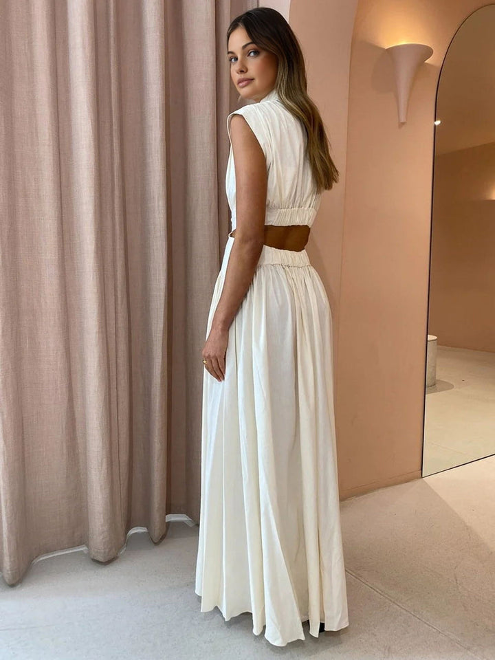 Abito lungo estivo da donna con design cut-out laterale, vestibilità fluida. Perfetto per outfit chic.