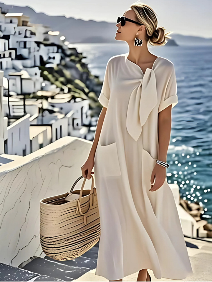 Abito elegante da donna nero con tasche, perfetto per un look chic serale o casual primavera.