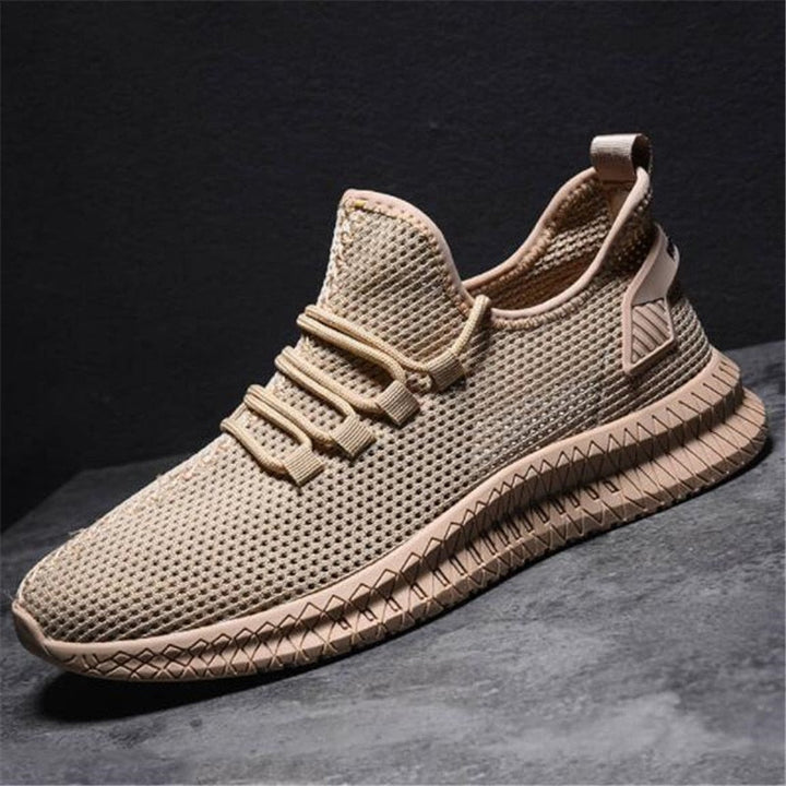 Sneakers sportive uomo grigie, ammortizzate e traspiranti, per comfort elevato durante l'allenamento.