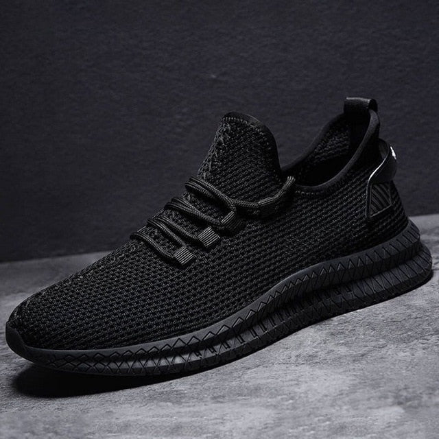 Scarpe sportive uomo leggere e traspiranti, design moderno per comfort e stile primavera/estate.