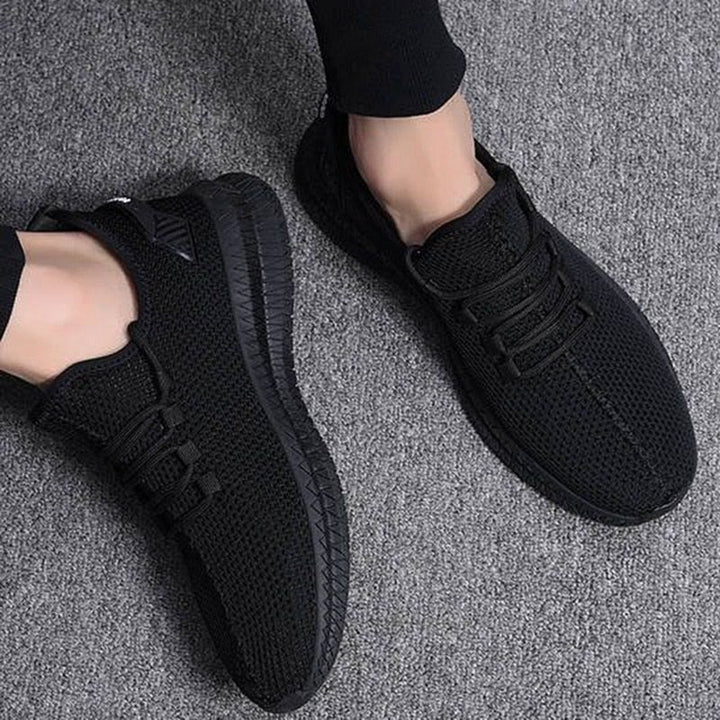 Sneakers uomo grigie, traspiranti e ammortizzate, perfette per allenamento e uso casual quotidiano.