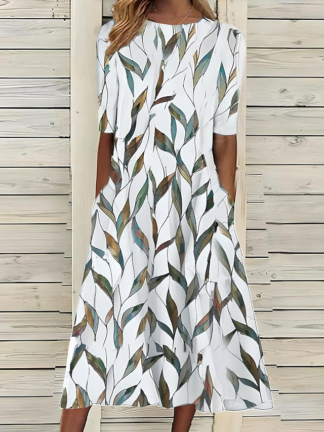 Abito midi da donna a stampa floreale, comodo e leggero, ideale per l'abbigliamento casual estivo.