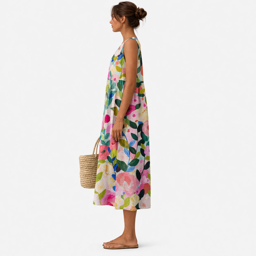 Elegante abito floreale midi da donna, senza maniche, versatile per occasioni casual o estive.