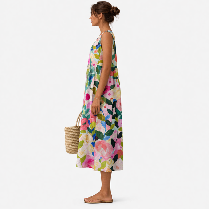 Elegante abito floreale midi da donna, senza maniche, versatile per occasioni casual o estive.