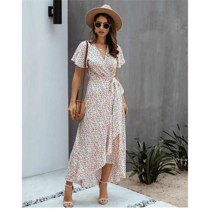 Maxi abito floreale da donna con scollo a V e volant, ideale per l'estate, look chic e fluido.