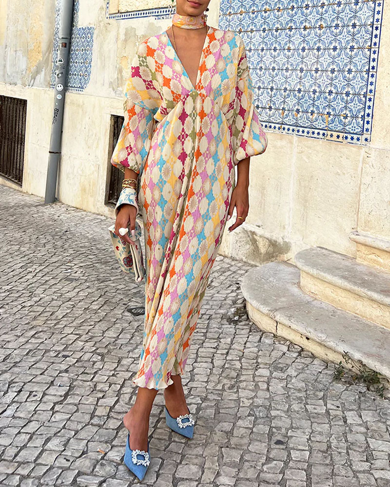 Abito maxi donna elegante con scollo a V, maniche a palloncino e stampa floreale, perfetto per la moda estiva.