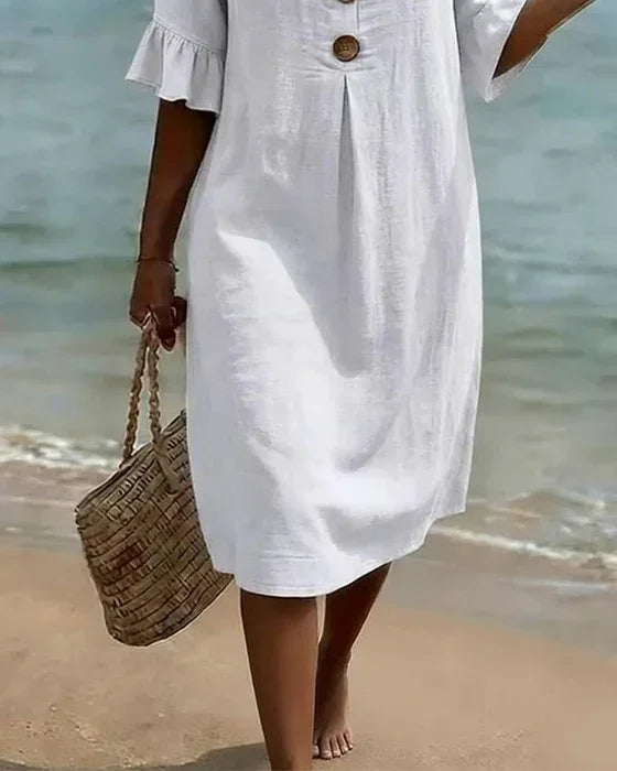 Abito midi donna per un look quotidiano chic, scollo a V e maniche a volant, comfort e stile senza sforzo.