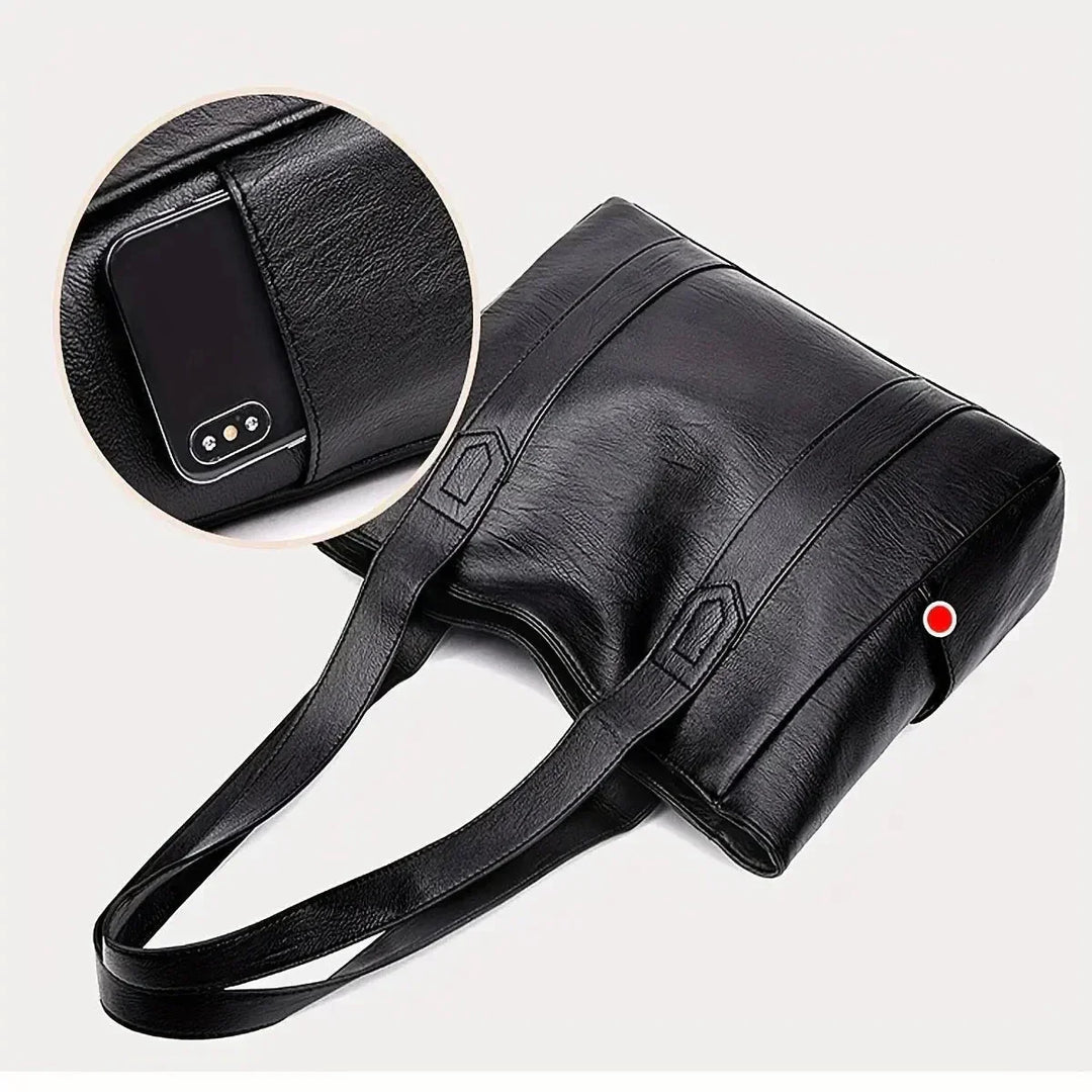 Accessorio donna: borsa a spalla in vera pelle. Design classico e funzionale per la quotidianità.