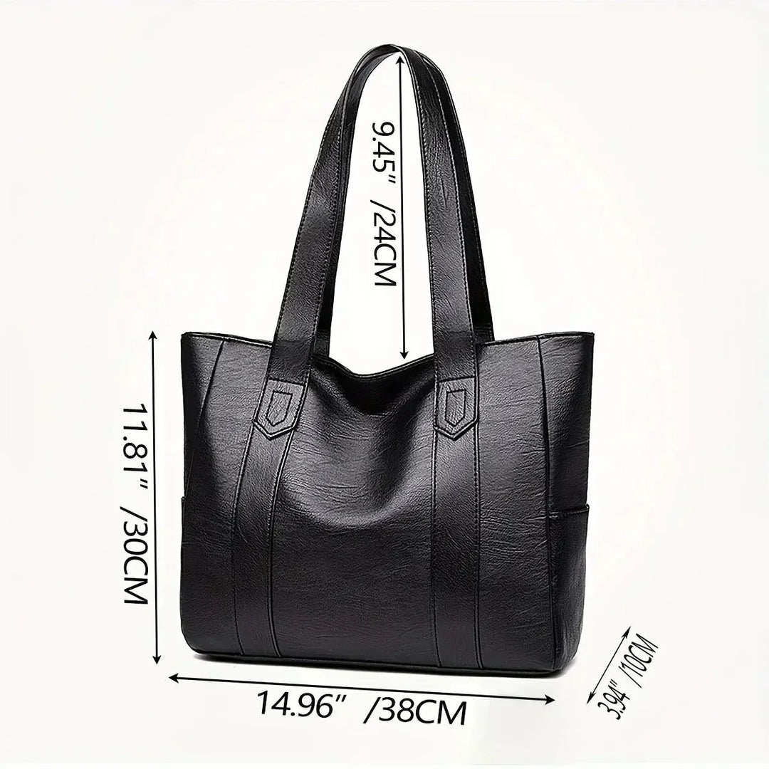 Donna con borsa a spalla in vera pelle. Stile classico ed elegante per la vita di tutti i giorni.