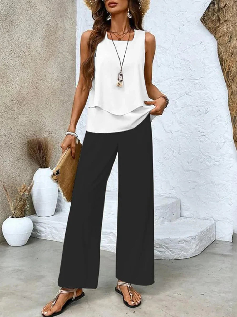 Set casual elegante donna a righe: top scollo quadrato e pantaloni fluidi. Ideale per la moda estiva e primavera.