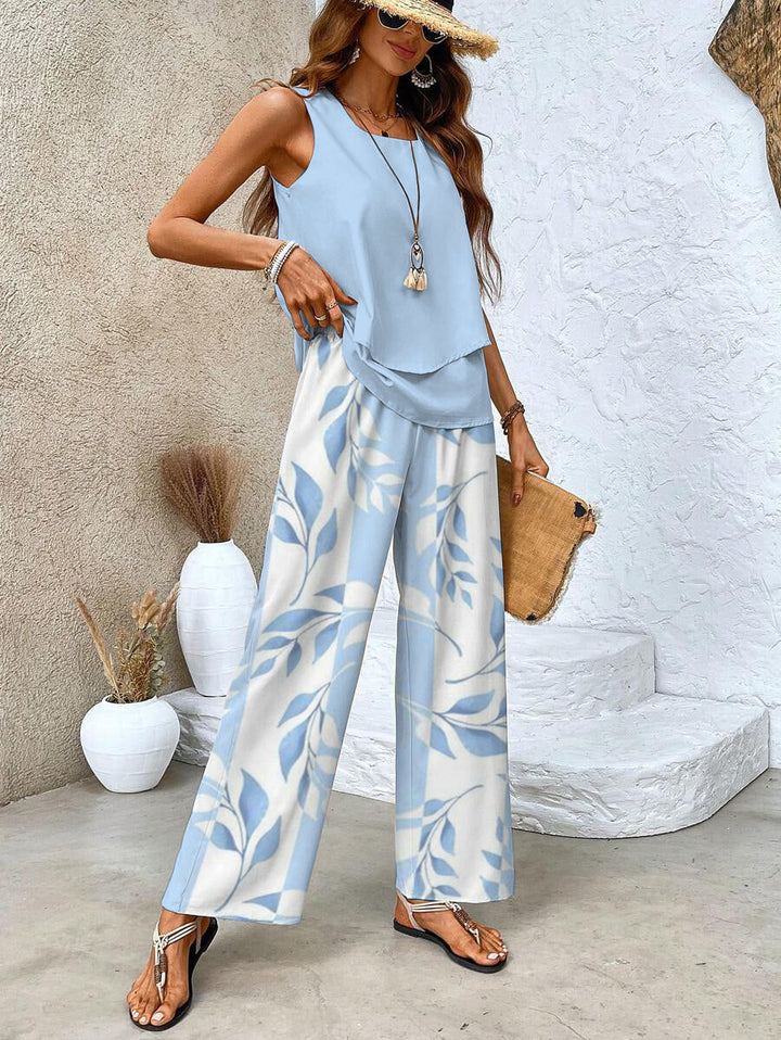 Abbigliamento estivo donna: completo a righe con top scollo quadrato e pantaloni fluidi. Look casual elegante trendy.