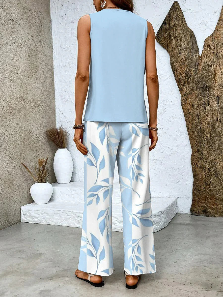 Completo donna a righe estivo con top scollo quadrato e pantaloni fluidi. Outfit coordinato primavera estate casual.